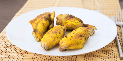 fried chicken wings on white plate