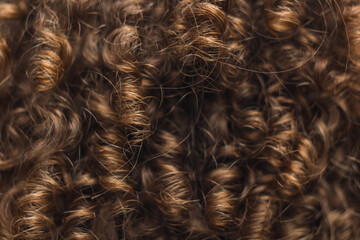 texture of male curly hair close up. perm for men. stylish hairdo
