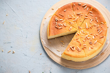 Homemade Cheesecake with Almonds. Copy Space Background, Top Down View