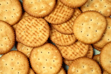 Biscuits are a crunchy snack product made by baking them. Several types of biscuits are arranged in unique formations to create a beautiful image that is suitable as a background. Wallpaper biscuits.