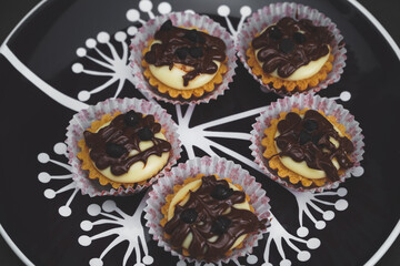 selective focus of cheese tart on the table with a cinematic light.