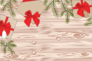 gifts on a wooden background with a red ribbon with spruce branches. view from above