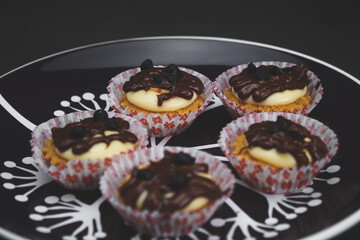 selective focus of cheese tart on the table with a cinematic light.