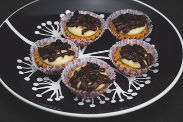 selective focus of cheese tart on the table with a cinematic light.