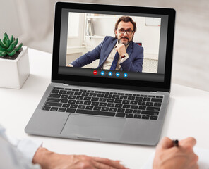 Business People Having Virtual Meeting Via Web Call On Laptop In Office
