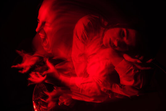 scary portrait of a ghost girl in a white shirt with a blur