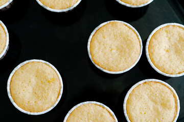 freshly baked cupcakes on a black protvin background.Food for breakfast. Freshly baked cupcakes for dessert. Foodies and cuisine.