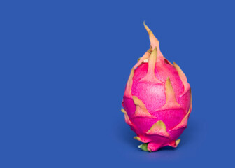 Ripe whole dragon fruit with white flesh. The pink pitaya fruit is low in calories, rich in...