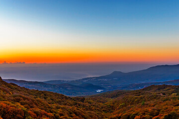 sunset over the hills and the sea in crimea on an autumn evening