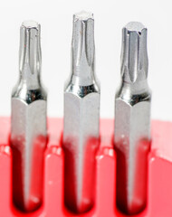 Screwdriver bits made from tool steel in the red box photographed against a white background in the studio