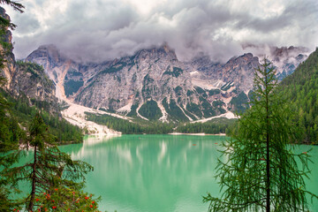 Fototapeta na wymiar Lake Braies (Lake Prags or Pragser Wildsee) is a lake in the Prags Dolomites in South Tyrol, Italy. Hiking travel and adventure.