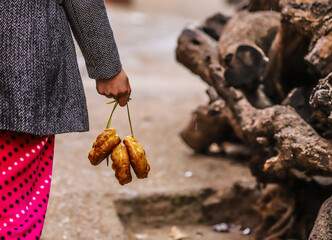 A girl with the Moroccan donuts that locals call “ Shfnj “ or “Chfanj”. They are often consumed with Moroccan tea. Morocco, Beni Mellal, 11.11.2019 .
