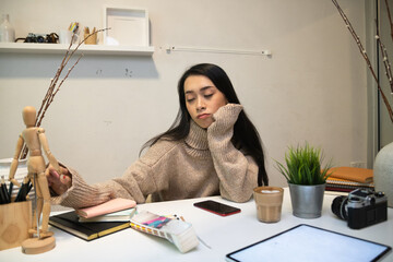 Cropped shot of two UI developers meeting on their project with paperwork and tablet on meeting...