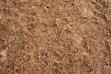 texture of the icy snow-covered road, sprinkled with sand. winter season background