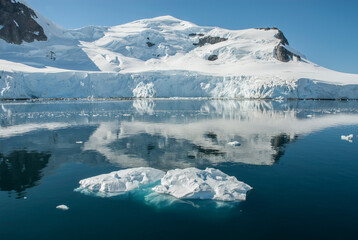 Snowy mountains in sunny day, Paraiso Bay, Antartica.