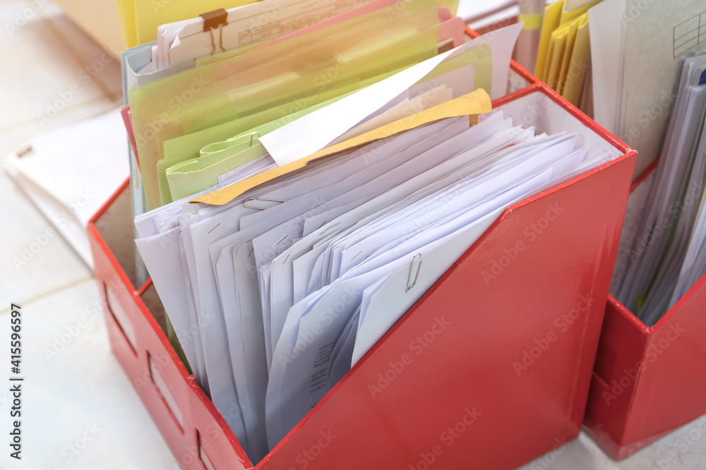 Sticker Stack boxes of Education report in school, Business or Class documents of red Binders file Paperwork folder on teacher desk in university