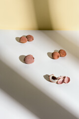 Fresh Lychee fruit on light background. Minimal fruit and summer concept.