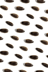 Black sunflower seeds isolated on white background. Raw whole grains