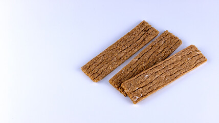 fitness crispbreads lie in a white plate, isolated