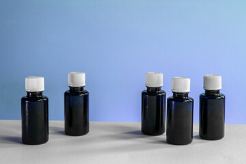 bottles of medicine on white and blue background