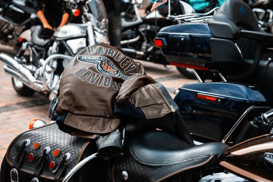 Nice old black leather jacket Harley Davidson logo on biker at Crazy Hohols Bikers club open season Kiev Ukraine 21 april 2018