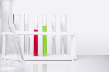 Water quality monitoring in chemical laboratories. The red chemical in the test tube has a high PH...