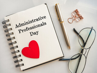 Admin Day Greeting Card. Close-up, view from above, wooden surface. Concept of preparation for a professional holiday. Congratulations for relatives, friends and colleagues