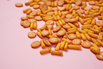 Biscuits are a crunchy snack product made by baking them. Several types of biscuits are arranged in unique formations to create a beautiful image that is suitable as a background. Wallpaper biscuits.