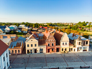 Obraz premium Beautiful aerial view of the market square of Kedainiai, one of the oldest cities in Lithuania. Unique colorful Stikliu houses in golden sunset light.
