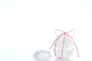 Edible gift delicious meringues on a white background, isolated, close up