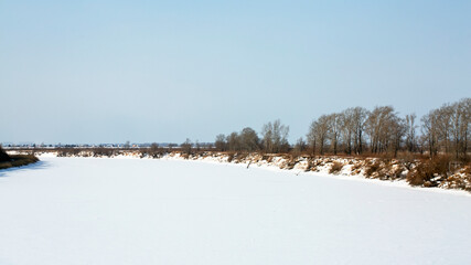Winter snow rural river landscape. Forest river in winter. Winter forest river view