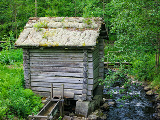 old waterweel house in forest