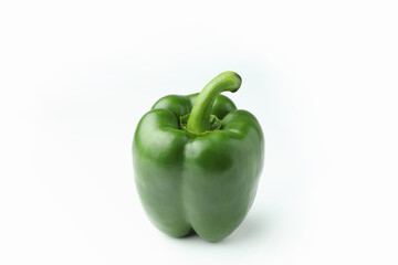 Closeup green bell pepper on a white background with copy space.