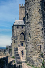 Ancient narrow streets in the old town of Carcassonne with stone walls