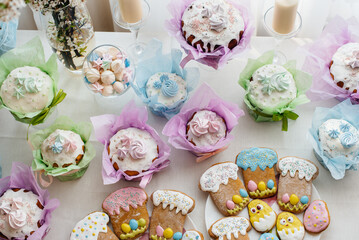 Beautiful Easter cakes on a decorated light table. A light holiday of Easter.