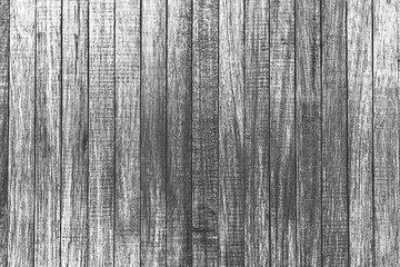 Texture of rural stained exterior vertical oak planks of country shed. Old dirty rough siding of gnarled surface wooden paneling. Rustic veined facing lumber fence of hard boards for 3D style design