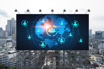 World planet Earth map hologram and social media icons on billboard over panorama city view of Bangkok, Southeast Asia. The concept of people networking and connections.