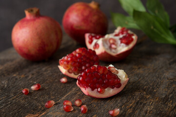Fresh ripe pomegranate on a wooden background