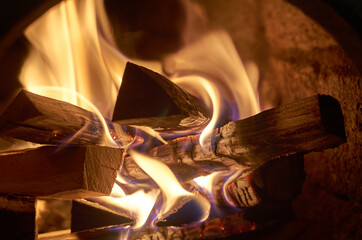 Fototapeta premium Firewood is burning in the stove