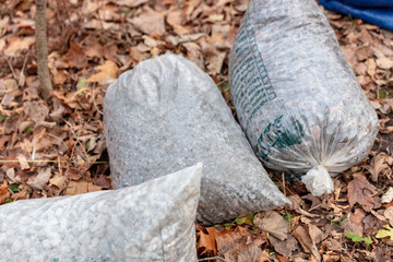 Gravel bags on fallen leafs