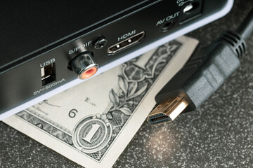 money under the TV set-top box and the cable is disconnected from