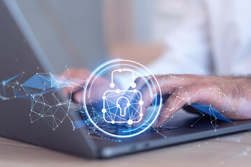 A programmer is typing a code on computer to protect a cyber security from hacker attacks and save clients confidential data. Padlock Hologram icons over the typing hands. Formal wear.