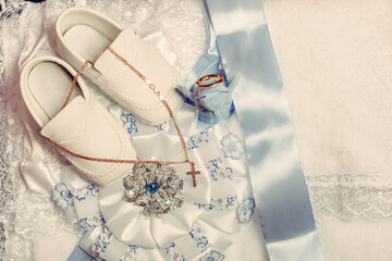 Small additions for baby baptism, clothes and shoes for the baby.