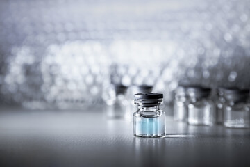 Vaccine prototype Bottle of covid-19 and Syringe. Coronavirus Vaccine in laboratory, hospital or pharmacy. Medicine bottle for injection . Drug Ampoule Mockup. Vaccination concept.