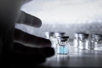 Vaccine prototype Bottle of covid-19 and Syringe. Coronavirus Vaccine in laboratory, hospital or pharmacy. Medicine bottle for injection . Drug Ampoule Mockup. Vaccination concept.