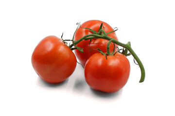 three red tomatoes on a white background