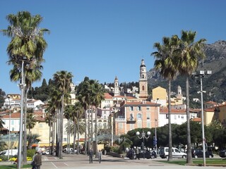 Promenade in Menton, France, with the old town in the backgrounr