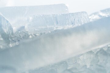 Obraz na płótnie Canvas Stacks of drift ice piled up against the dutch coast with crystal clear sunlight
