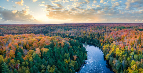 Awesome sunrise from the Upper Tahquamenon Falls in Autumn - Michigan State Park in the Upper Peninsula - waterfall