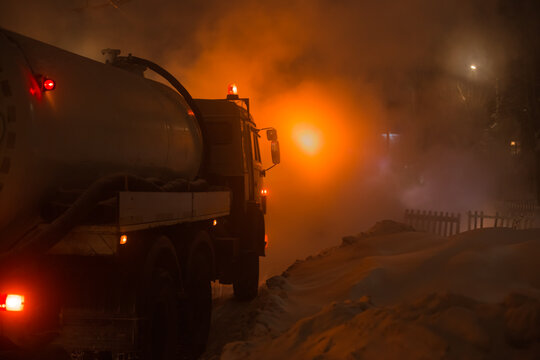 Workers Of The City Utility Service Fix An Accident On The Pipeline Of Heating Networks On A Frosty Winter Night